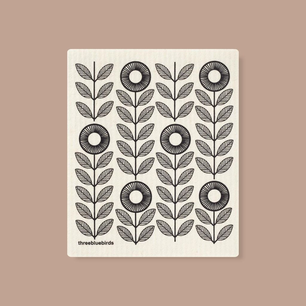 Reusable Swedish Dishcloth with black sunflower pattern, perfect for eco friendly kitchens.