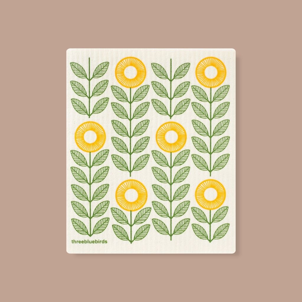 Durable Swedish dishcloth featuring green and yellow sunflower design, gentle on dishes and surfaces.