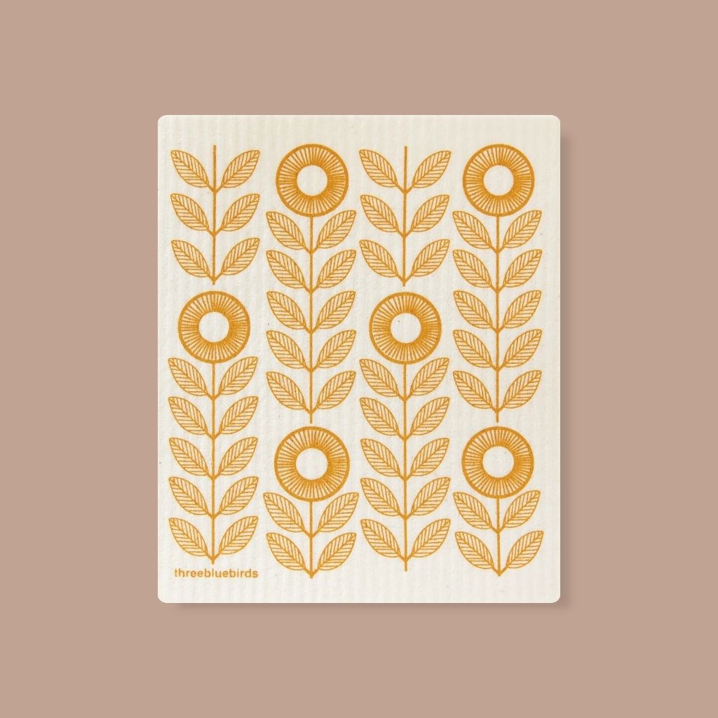 Swedish eco dishcloth with mustard yellow sunflowers, made from compostable cellulose.