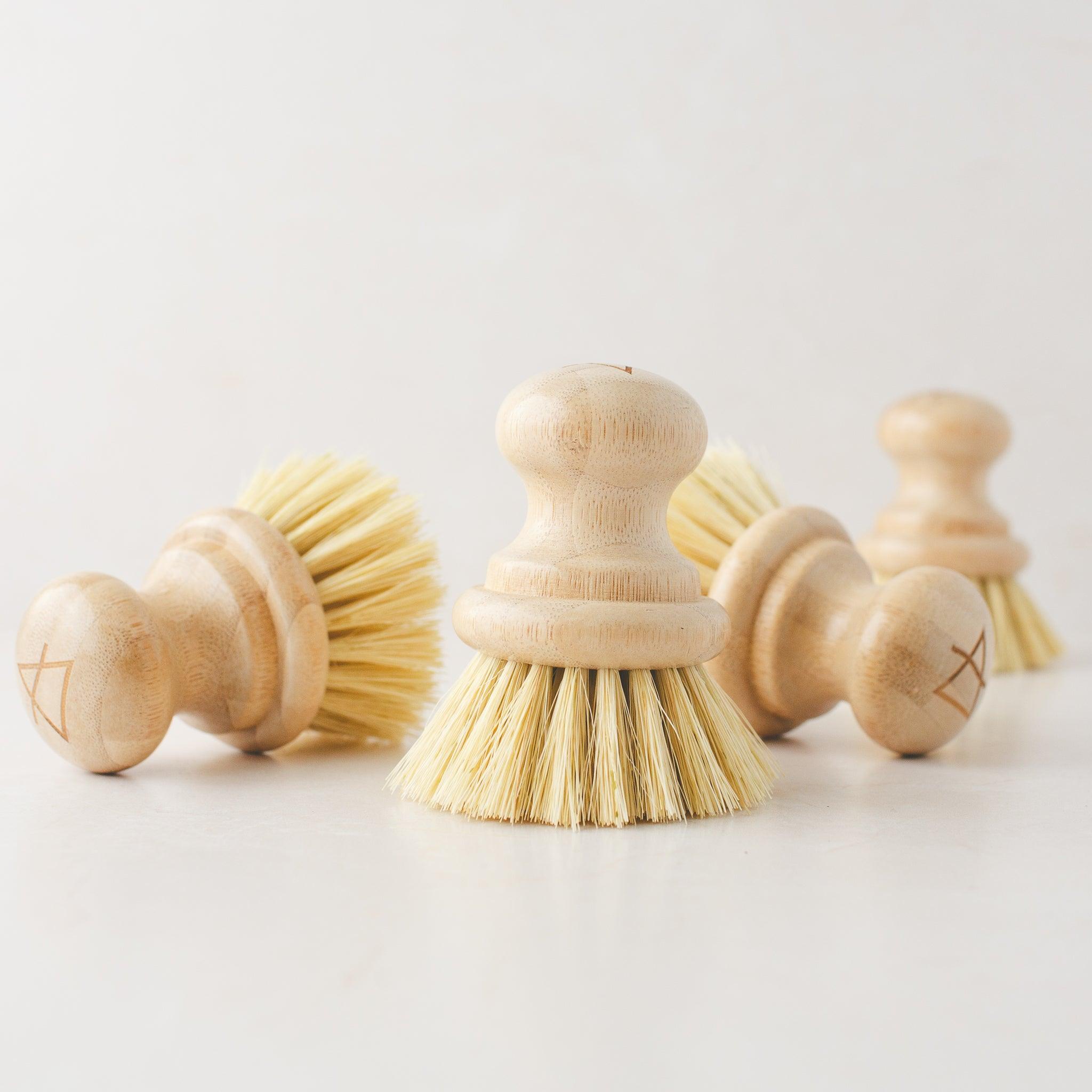 Handheld eco dish brush with ergonomic design for comfortable use.