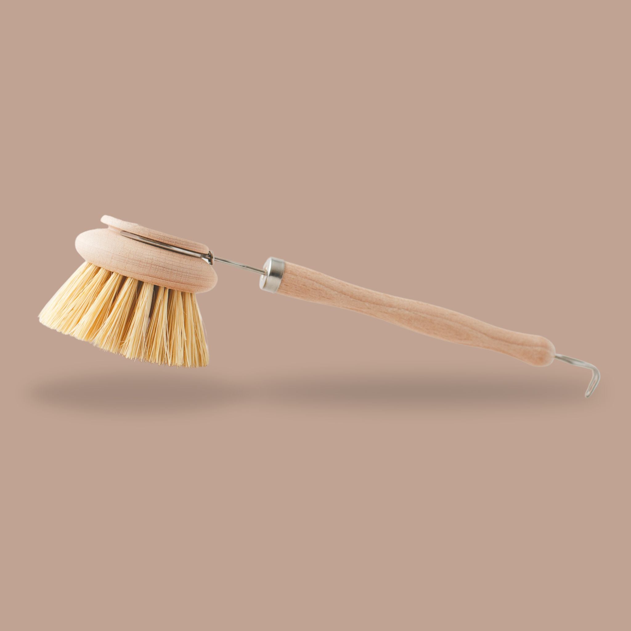 Plastic-free long handle dish brush promoting zero waste living.