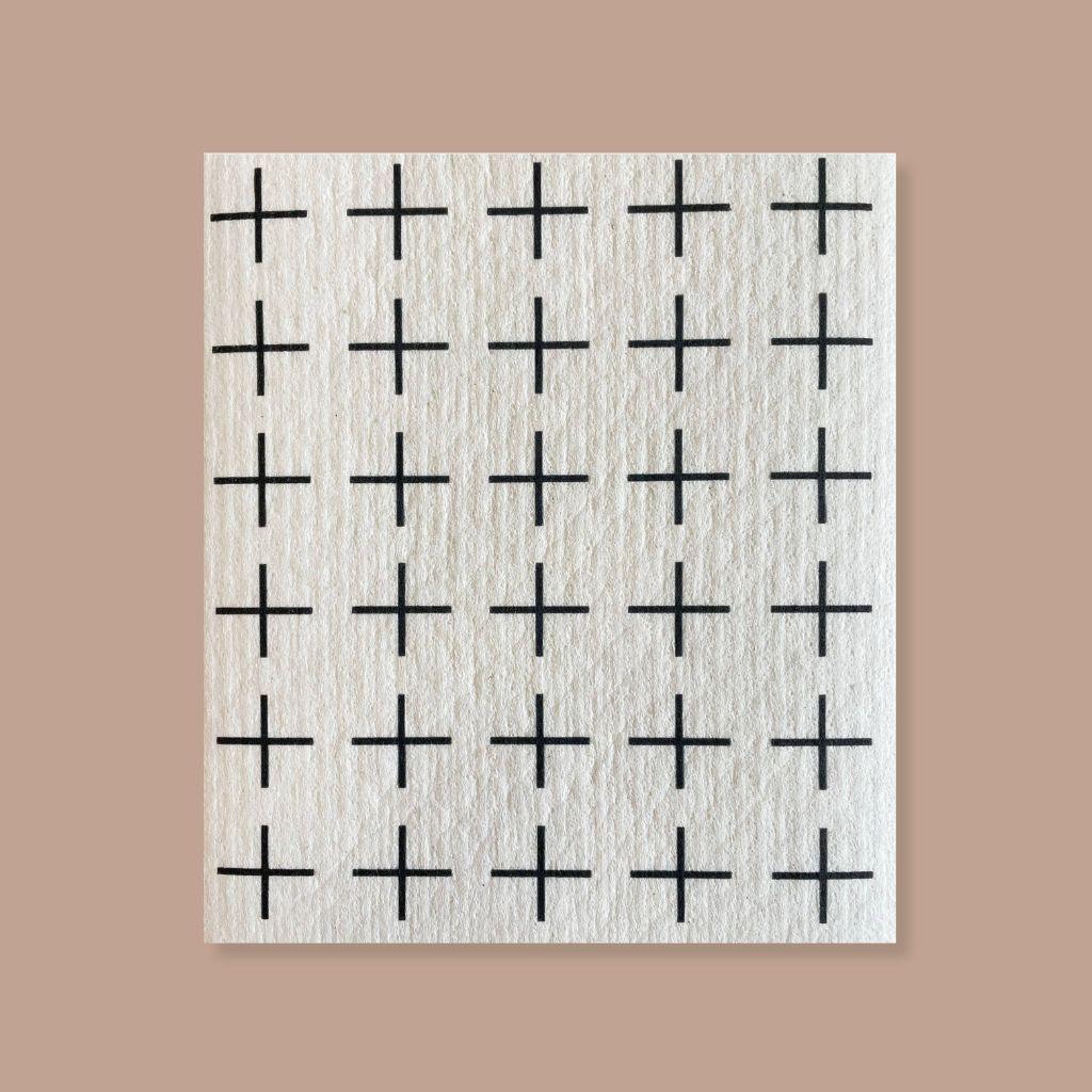 Plant-based Swedish dishcloth with minimalist Scandinavian plus-sign pattern, reusable and machine washable.