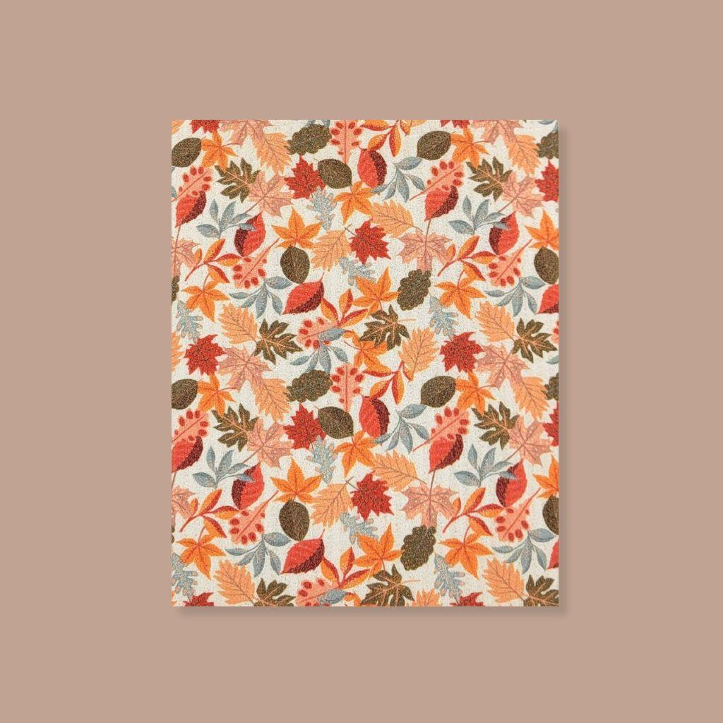Reusable Swedish sponge cloth with vibrant fall leaf pattern, plastic-free cleaning solution.