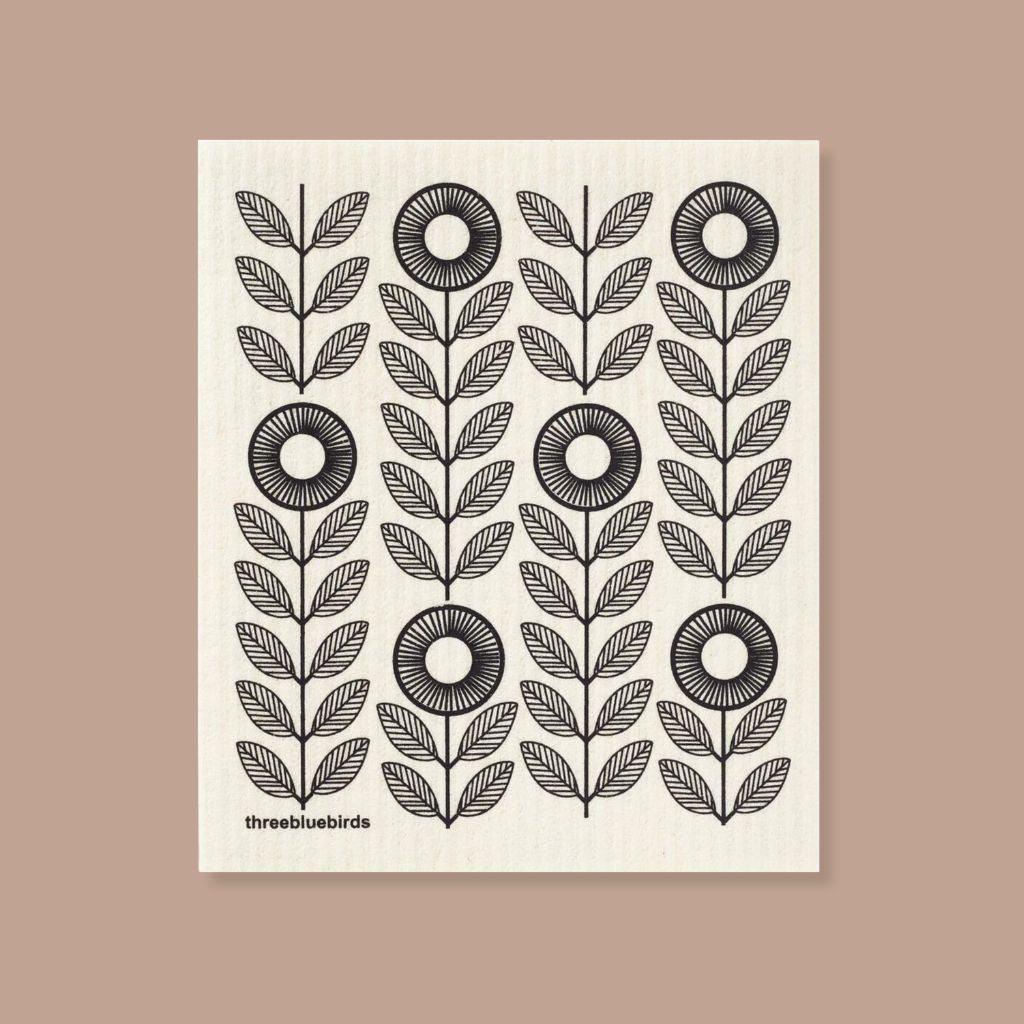 Reusable Swedish Dishcloth with black sunflower pattern, perfect for eco friendly kitchens.