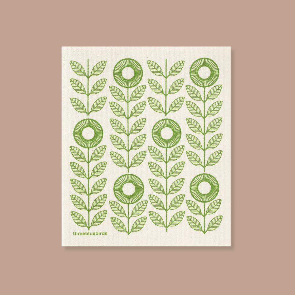 Eco-friendly Swedish dishcloth with green sunflowers design, stylish and functional.