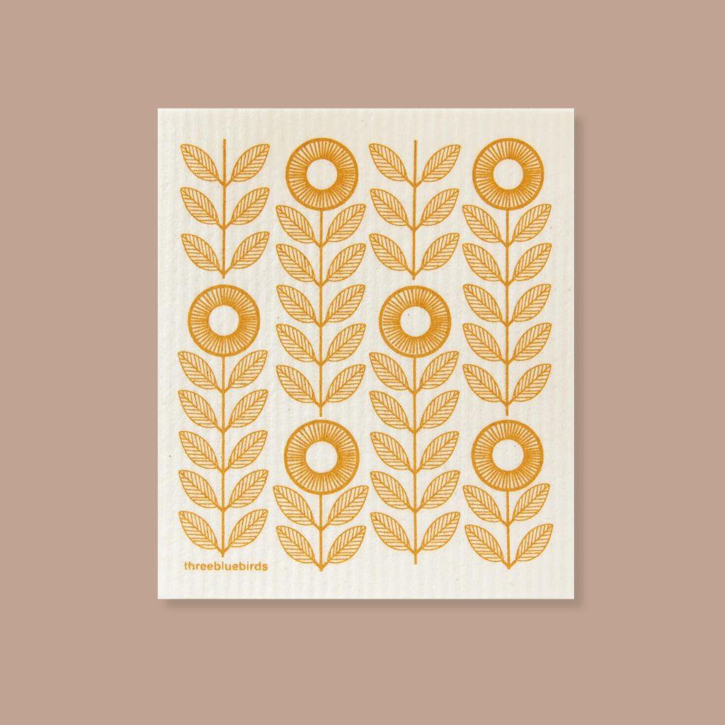 Swedish eco dishcloth with mustard yellow sunflowers, made from compostable cellulose.