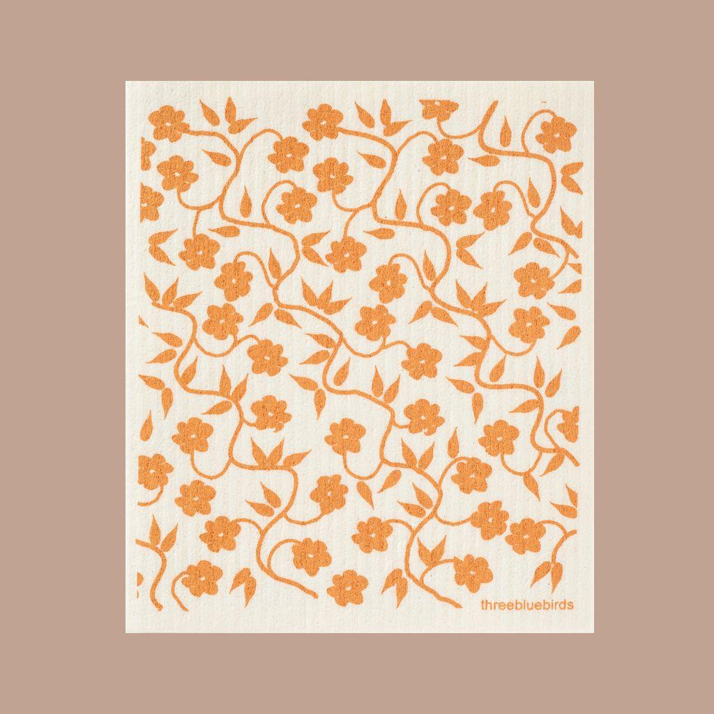 Eco-friendly Swedish Dishcloth in orange flowering vines print, ultra absorbent and reusable.