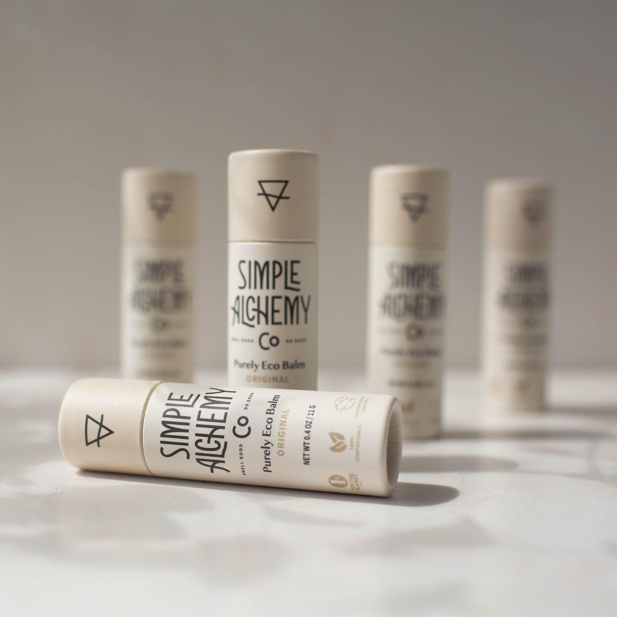Off-white compostable paper tubes of original vegan lip balm.