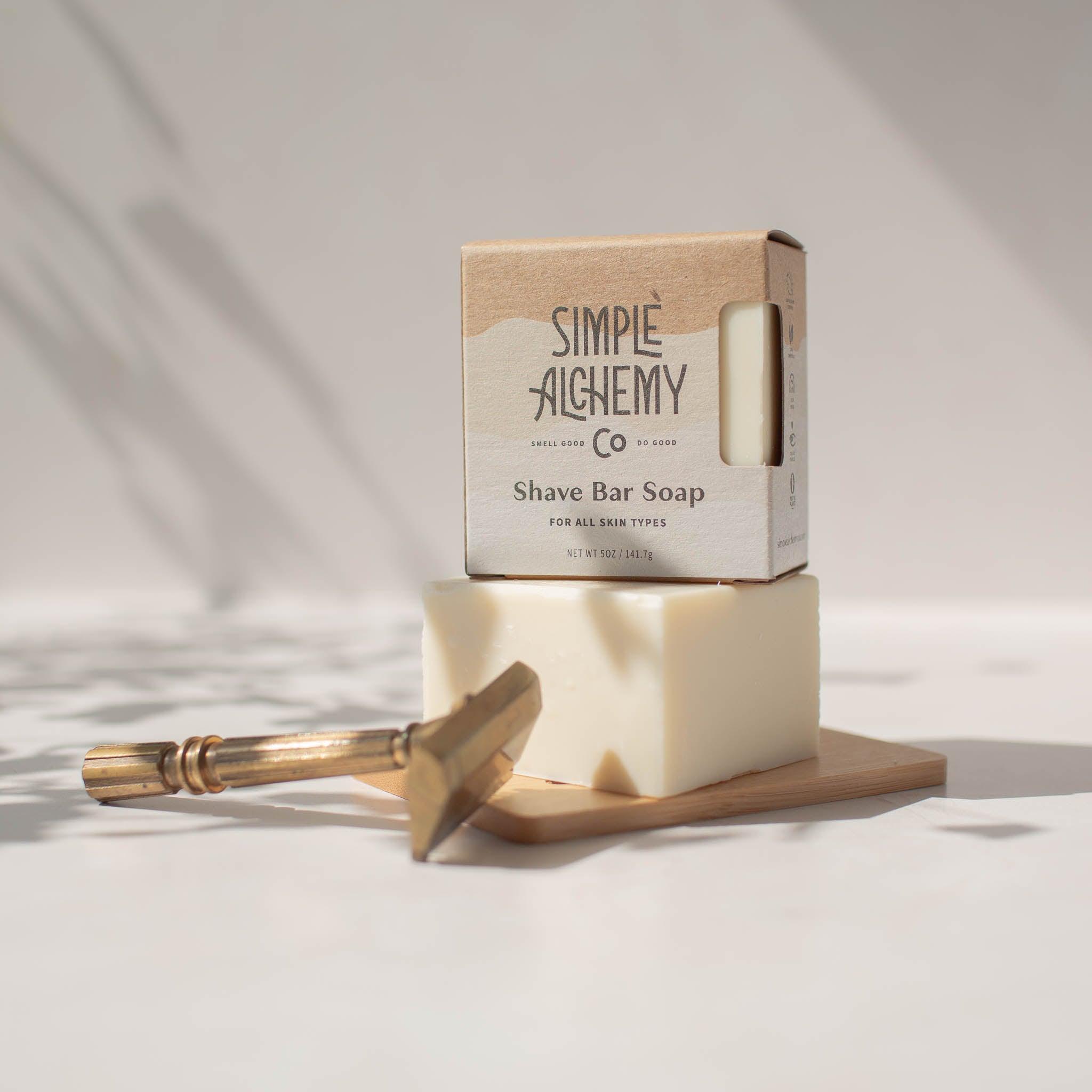 Square, branded box with cutout showing white Shave Bar Soap.