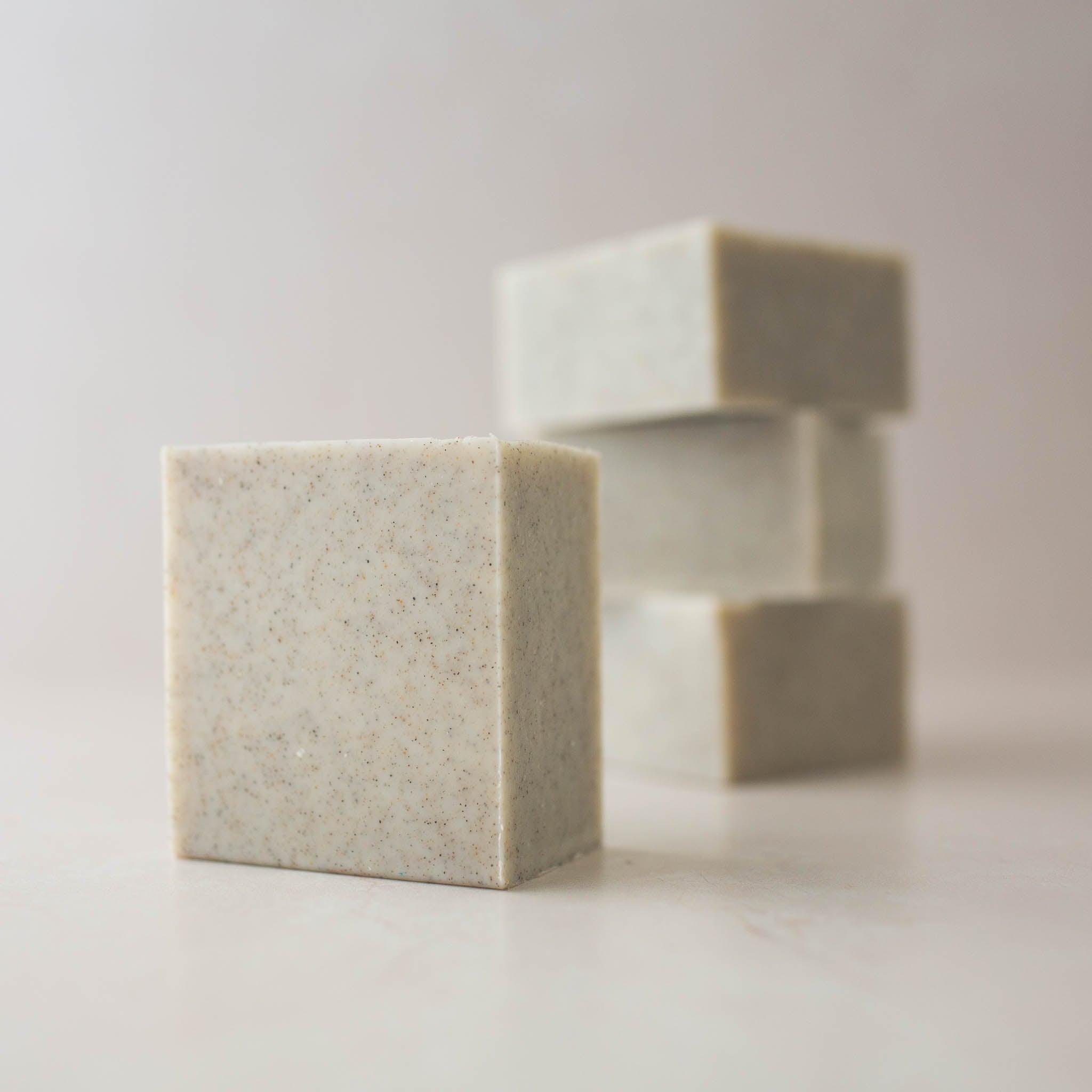 Bars of light gray vegan exfoliating Scrub Bar Soap soap made with Oregon Coast sand.