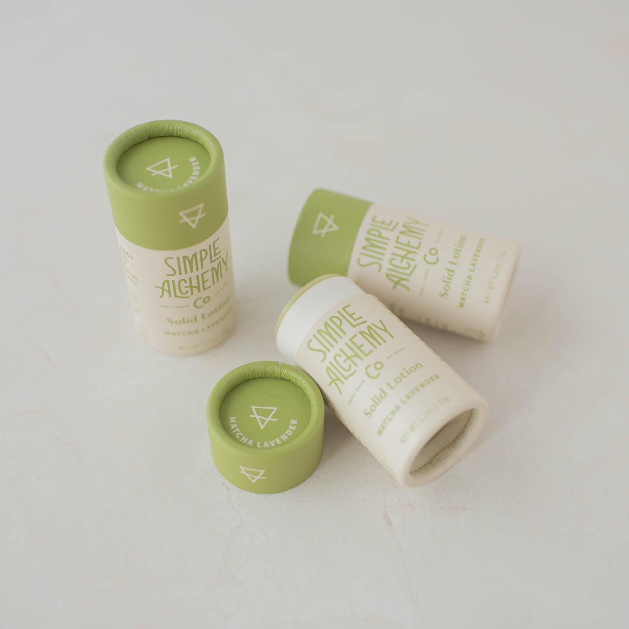 Trio of green and cream compostable tubes of Matcha Lavender Solid Lotion.